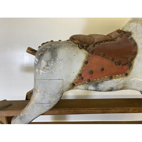 235 - A mid 20th century hand painted wooden rocking horse on beech stand - approx. 79cm high x 33cm wide ... 