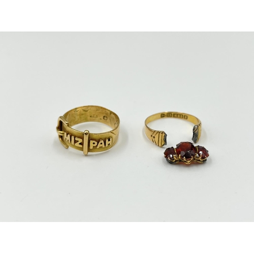 1126 - Two gold rings, one Mizpah - approx. gross weight 3.38 grams and one 15ct gold garnet trilogy ring -... 