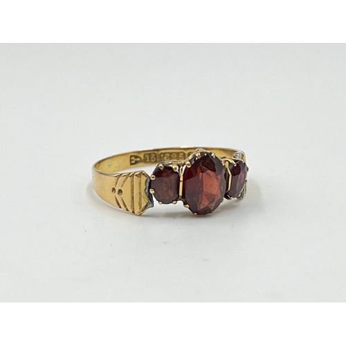 1126 - Two gold rings, one Mizpah - approx. gross weight 3.38 grams and one 15ct gold garnet trilogy ring -... 