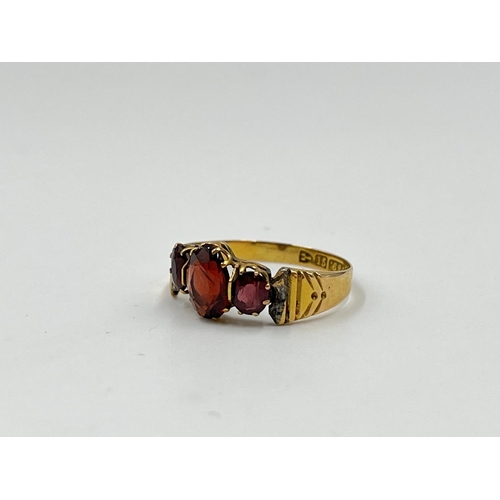 1126 - Two gold rings, one Mizpah - approx. gross weight 3.38 grams and one 15ct gold garnet trilogy ring -... 