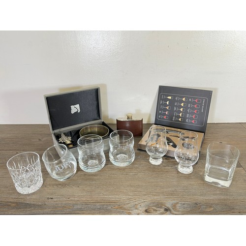 37 - A collection of advertising glasses and drinking accessories to include hip flask, wine tool set, Ju... 