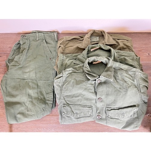 92 - A collection of military clothing to include shirt, jacket, leather belt etc.