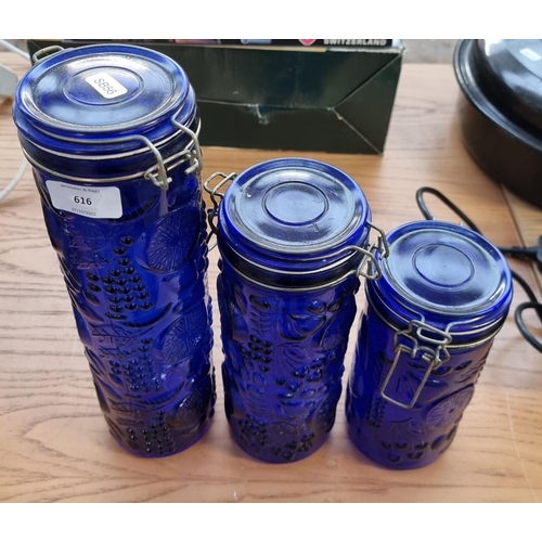 616 - Three blue glass storage jars - tallest approx. 33cm high