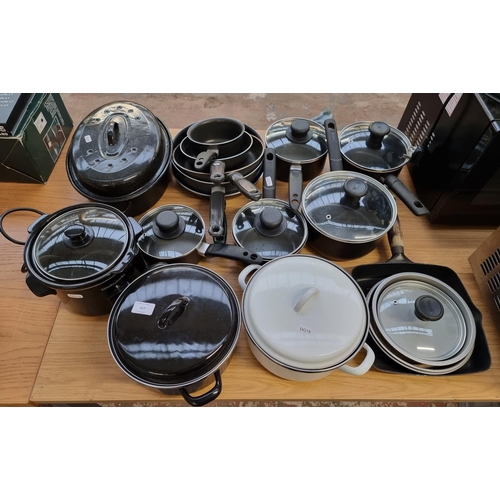 617 - A large collection of kitchenware to include Tefal lidded pans, Cookworks slow cooker etc.