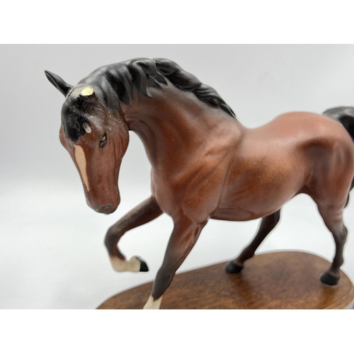 10 - A Royal Doulton Spirit of Freedom figurine on wooden plinth - approx. 20cm high x 25cm wide