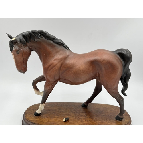 10 - A Royal Doulton Spirit of Freedom figurine on wooden plinth - approx. 20cm high x 25cm wide