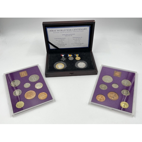 1302 - Three coins set to include cased 2014 First World War Centenary silver coin & medal collection compr... 