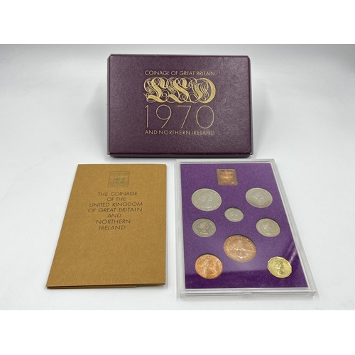 1302 - Three coins set to include cased 2014 First World War Centenary silver coin & medal collection compr... 