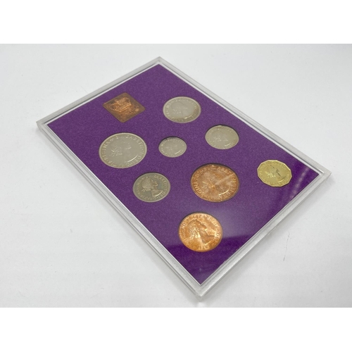 1302 - Three coins set to include cased 2014 First World War Centenary silver coin & medal collection compr... 