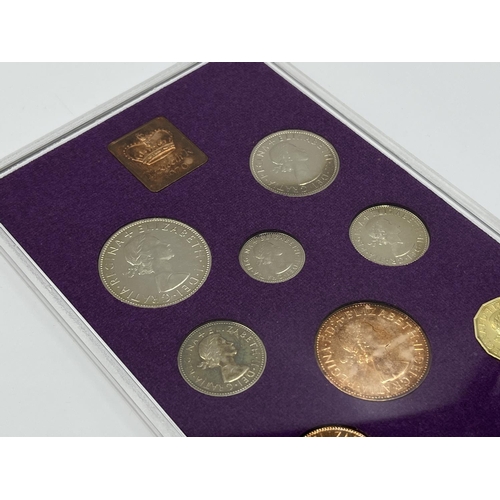 1302 - Three coins set to include cased 2014 First World War Centenary silver coin & medal collection compr... 