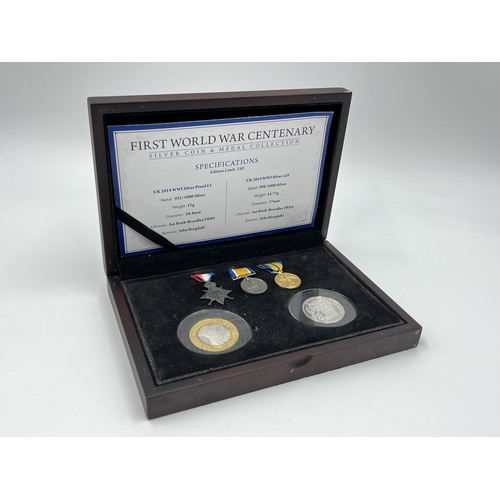 1302 - Three coins set to include cased 2014 First World War Centenary silver coin & medal collection compr... 