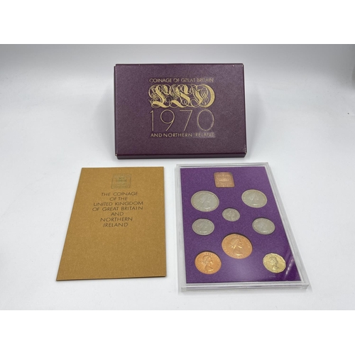 1302 - Three coins set to include cased 2014 First World War Centenary silver coin & medal collection compr... 