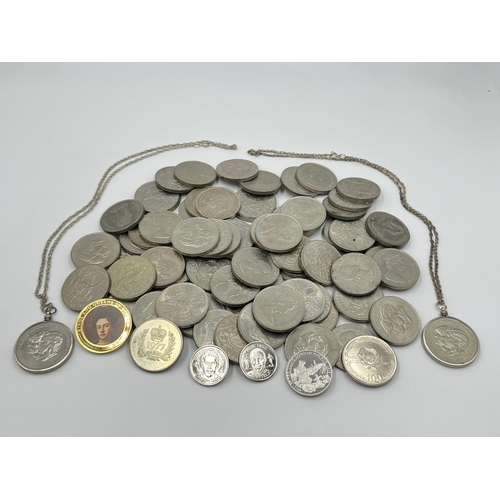 1303 - A large collection of mostly British commemorative coins to include 25 pence, five shillings etc.