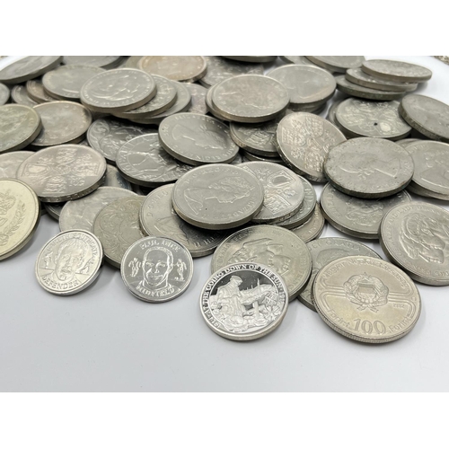 1303 - A large collection of mostly British commemorative coins to include 25 pence, five shillings etc.