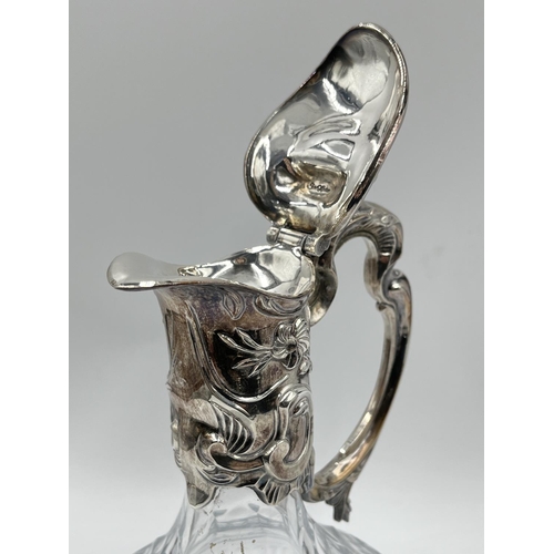 2 - A cut glass and silver plated claret jug - approx. 28cm high