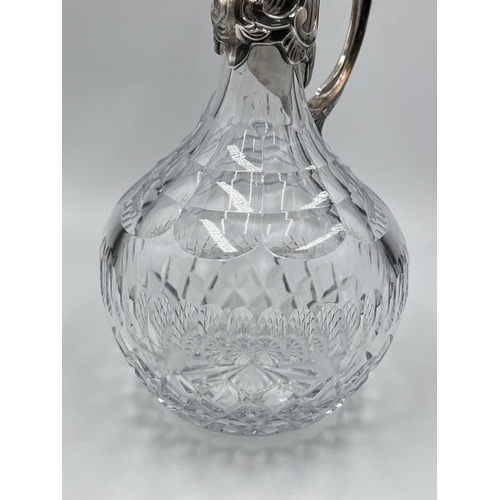 2 - A cut glass and silver plated claret jug - approx. 28cm high