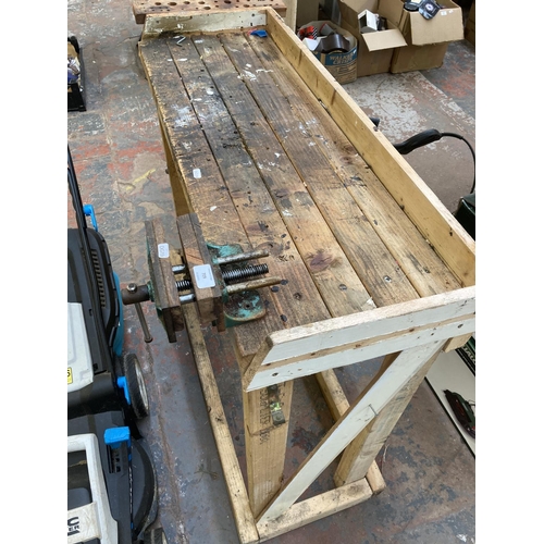 709 - A hand made pine work bench with P&B cast iron bench vice - bench approx. 94cm high x 111cm wide x 4... 