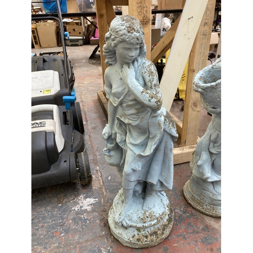 710 - Two cast stone garden ornaments in the form of ladies - largest approx. 70cm high