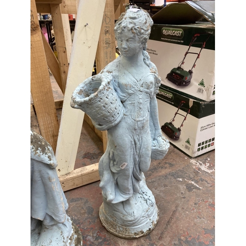 710 - Two cast stone garden ornaments in the form of ladies - largest approx. 70cm high