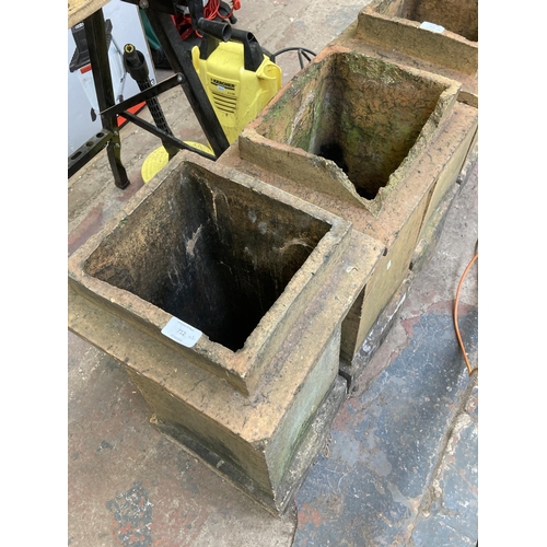 712 - Two Victorian cast stone chimney pots - approx. 67cm high x 33cm wide x 31cm deep