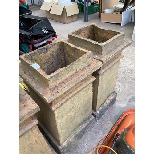 713 - Two Victorian cast stone chimney pots - approx. 67cm high x 33cm wide x 31cm deep