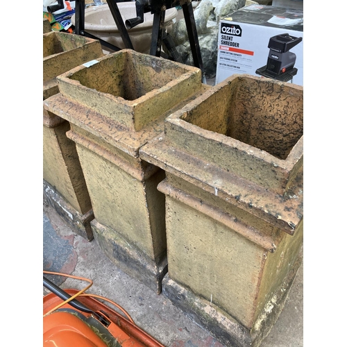 713 - Two Victorian cast stone chimney pots - approx. 67cm high x 33cm wide x 31cm deep