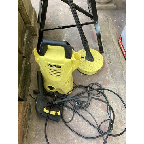 714 - Three items, one Karcher K2.130 240v pressure washer, one tile cutter and one GS folding work bench