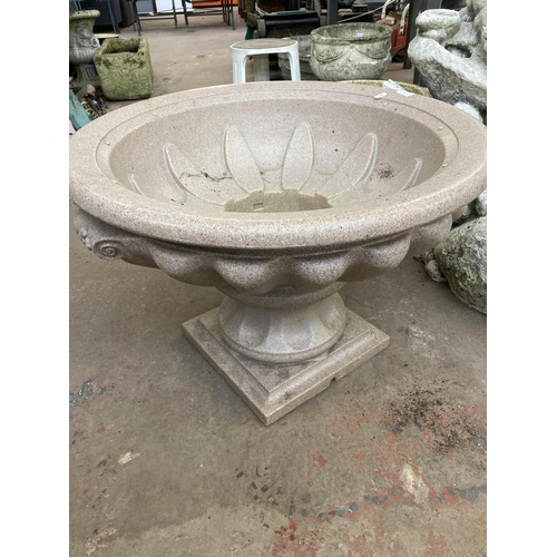 715 - Two garden items, one plastic water feature pedestal base and one fibreglass water feature in the fo... 