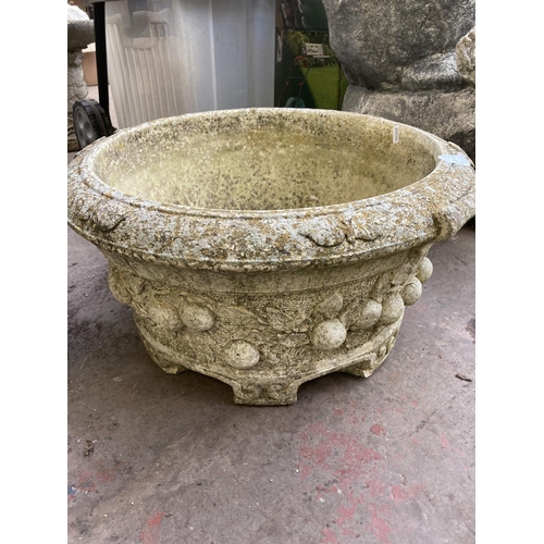 721 - Two cast stone garden planters - tallest approx. 43cm high