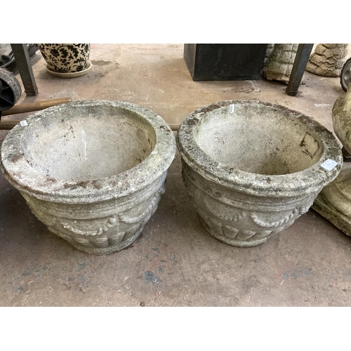 722 - A pair of cast stone garden planters - approx. 30cm high x 40cm diameter