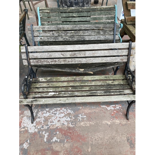 726 - Three cast iron and wooden slatted garden benches