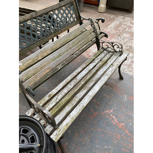 725 - Two cast iron and wooden slatted garden benches