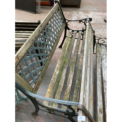 725 - Two cast iron and wooden slatted garden benches