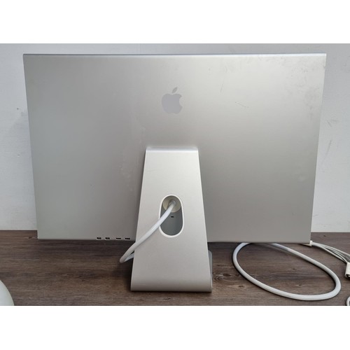 593 - Three Apple items, one iMac G4 desktop computer, one A1016 wireless keyboard and one A1083 cinema HD... 