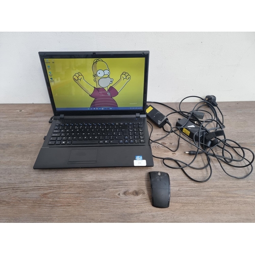 541 - An RM notebook 320 laptop with two power adapters and wireless mouse