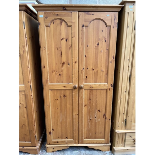 1003 - A modern pine double door wardrobe - approx. 195cm high x 101cm wide x 54cm deep