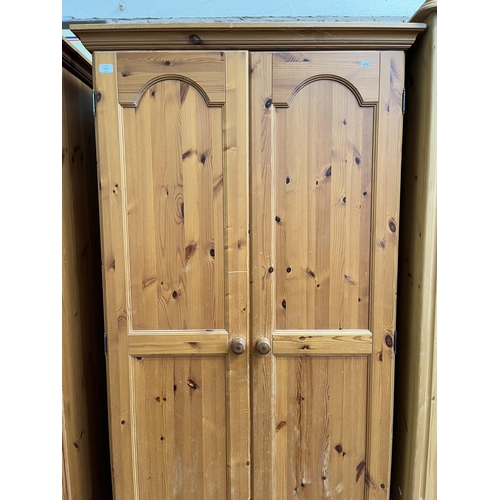 1003 - A modern pine double door wardrobe - approx. 195cm high x 101cm wide x 54cm deep