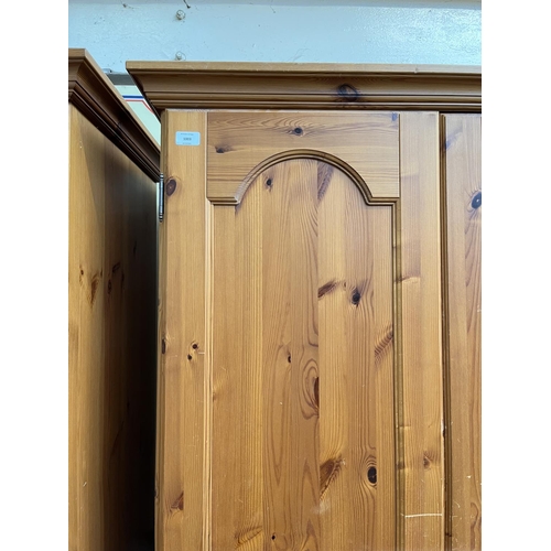 1003 - A modern pine double door wardrobe - approx. 195cm high x 101cm wide x 54cm deep