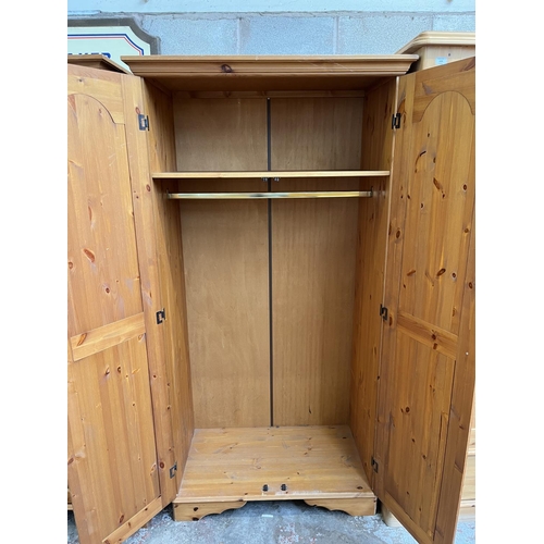 1003 - A modern pine double door wardrobe - approx. 195cm high x 101cm wide x 54cm deep