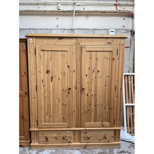 1004 - A modern solid pine double door wardrobe with two lower drawers - approx. 201cm high x 161cm wide x ... 