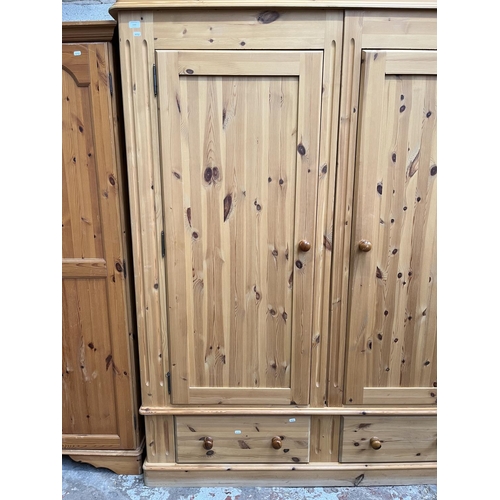 1004 - A modern solid pine double door wardrobe with two lower drawers - approx. 201cm high x 161cm wide x ... 