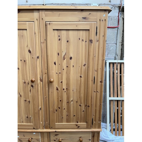 1004 - A modern solid pine double door wardrobe with two lower drawers - approx. 201cm high x 161cm wide x ... 