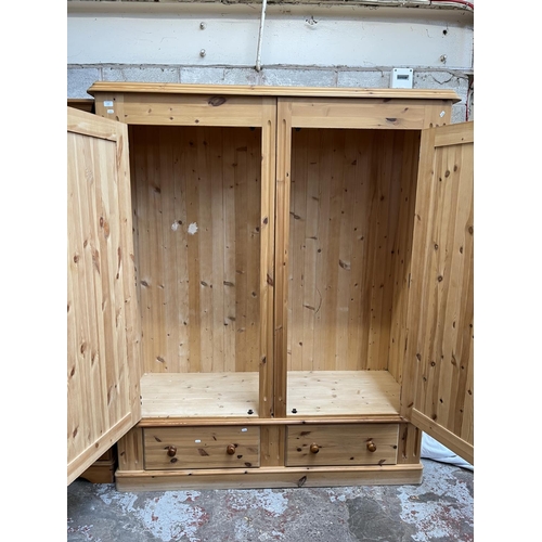 1004 - A modern solid pine double door wardrobe with two lower drawers - approx. 201cm high x 161cm wide x ... 