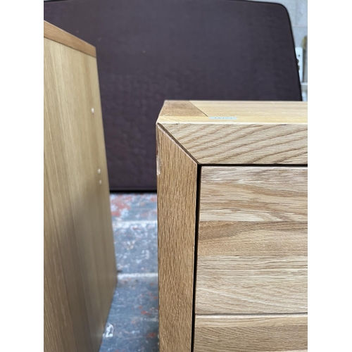 1014 - A pair of modern oak bedside chests of three drawers - approx. 62cm high x 47cm wide x 38cm deep