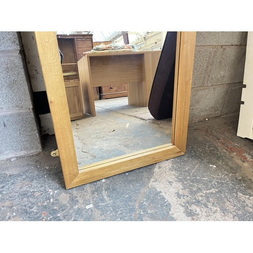 1022 - A modern oak framed wall mirror - approx. 170cm x 60cm