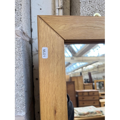 1022 - A modern oak framed wall mirror - approx. 170cm x 60cm