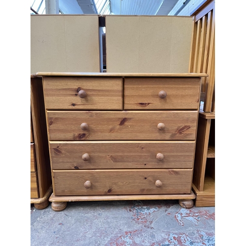 1025 - A modern pine chest of two short over three long drawers