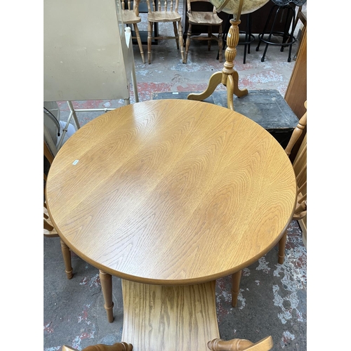 1029 - A modern oak and beech circular dining table and four matching chairs - approx. 74cm high x 90cm dia... 