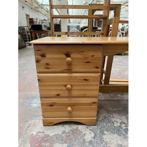 1035 - A modern pine dressing table with three drawers