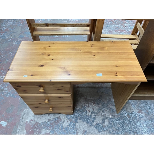 1035 - A modern pine dressing table with three drawers